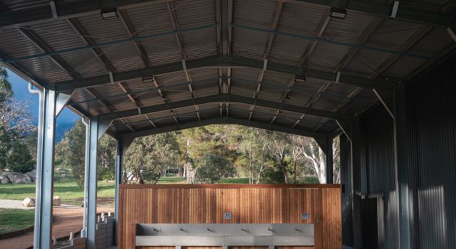 A stage with a wooden wall