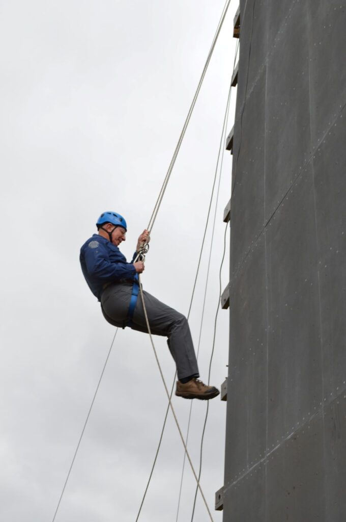 His Excellency The Governor General of Australia abseiling down a 10m tower at Outward Bound Australia.